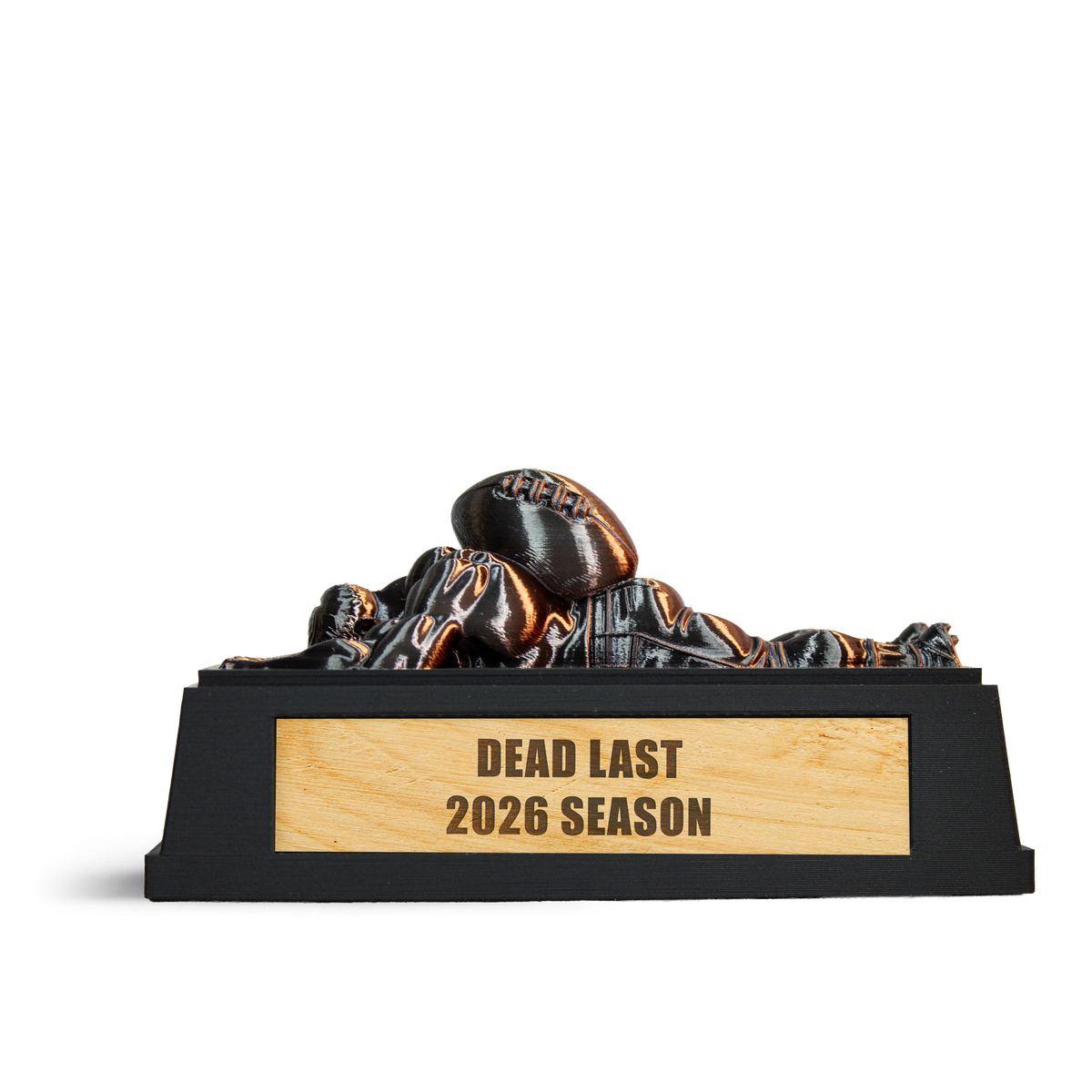 Dead Last fantasy football trophy: a bronze player lying face down under a football