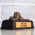 Dead Last trophy on a table, side view