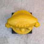 Carried the League trophy seen from above, gold football on the figure's shoulders