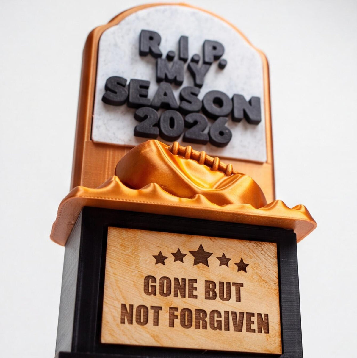 Close-up of the R.I.P. My Season gravestone and engraved plaque